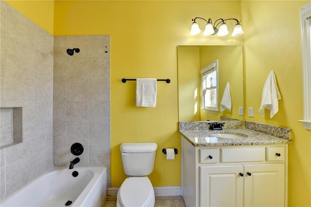 full bathroom with toilet, vanity, and tiled shower / bath combo