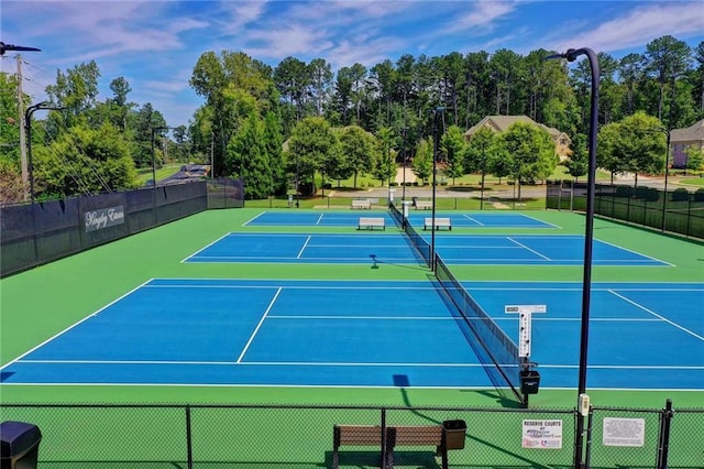 view of sport court with basketball hoop