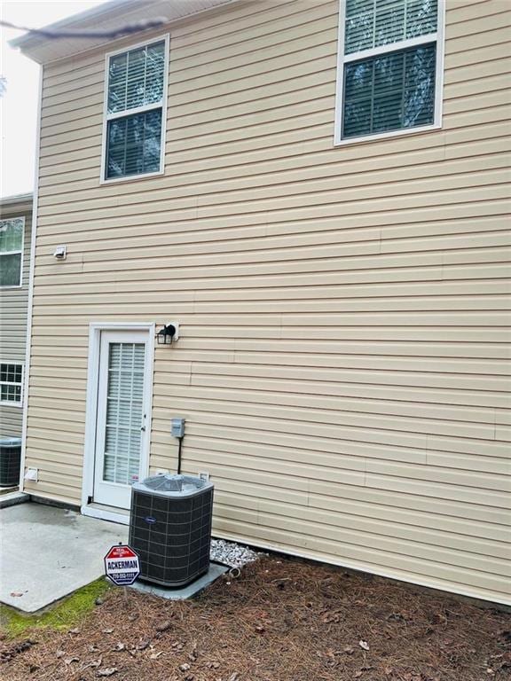 view of home's exterior featuring a patio area and central AC unit