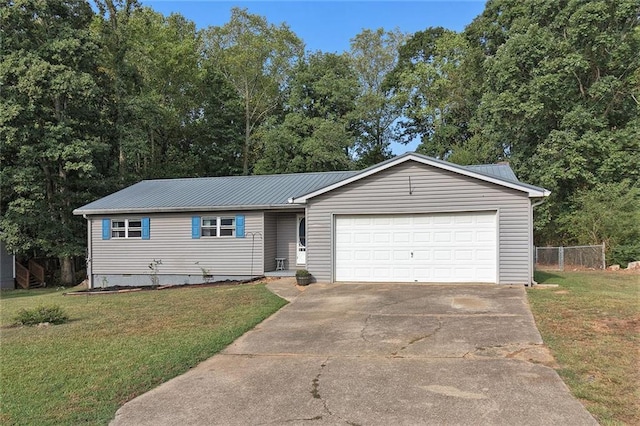 ranch-style house featuring a garage and a front yard