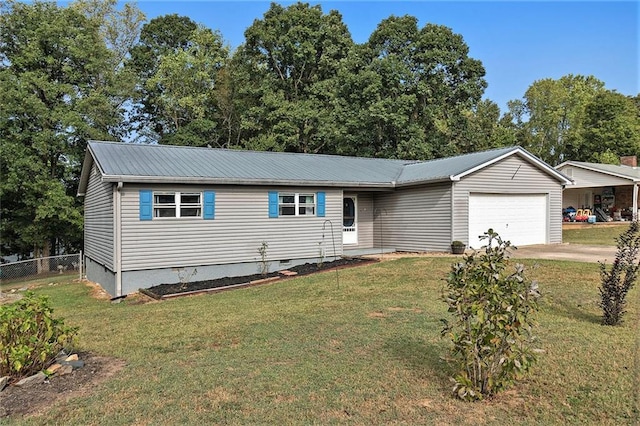 view of front of house featuring a garage and a front lawn