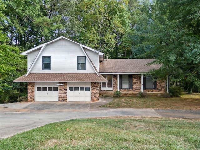 split level home with a garage and a front lawn