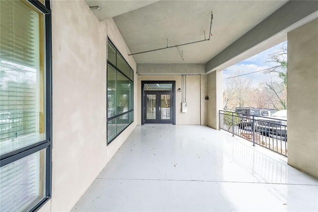 view of patio / terrace featuring a balcony and french doors