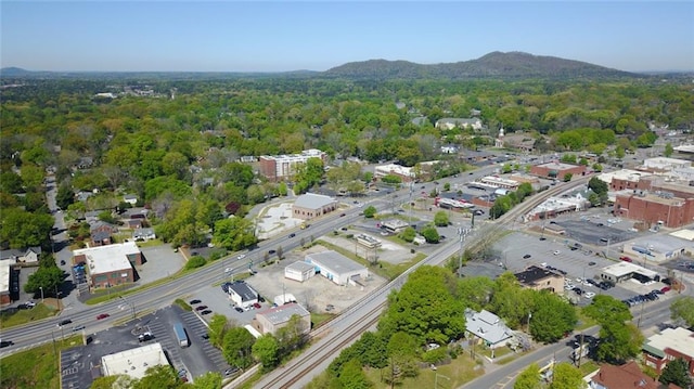 birds eye view of property with a wooded view