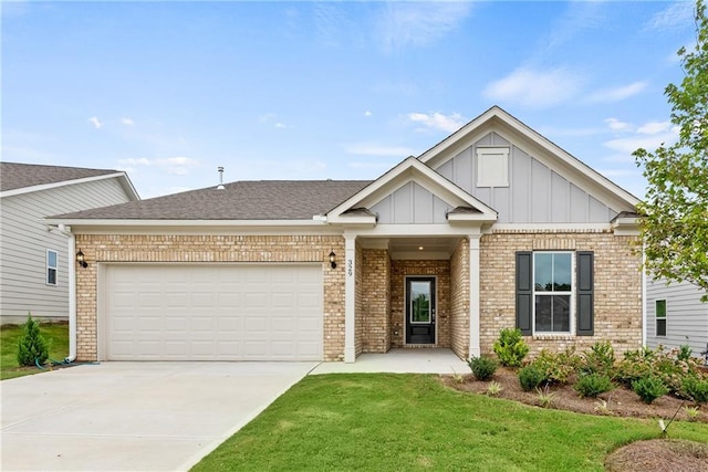 view of front of house featuring a garage and a front lawn