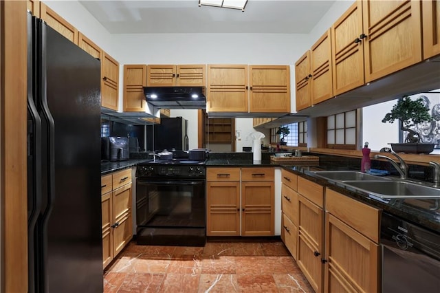 kitchen featuring dark stone counters, sink, kitchen peninsula, and black appliances