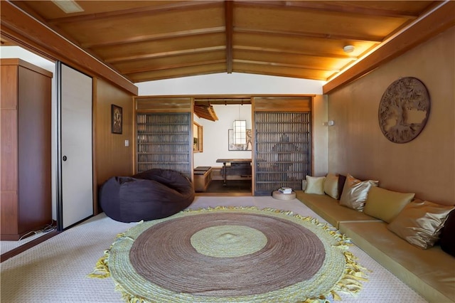 living room featuring lofted ceiling with beams