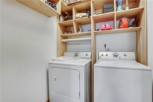 washroom featuring washing machine and dryer