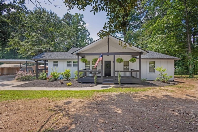 5601 Due W Rd, Powder Springs, GA 30127 - view of front of property with board and batten siding, covered porch, roof with shingles, and driveway