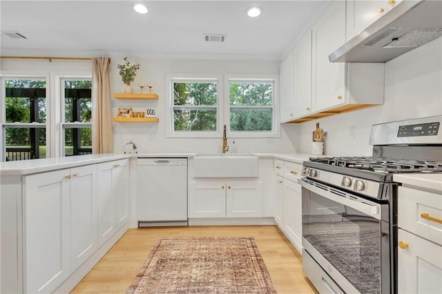 5601 Due W Rd, Powder Springs, GA 30127 - kitchen with stainless steel gas range, white dishwasher, extractor fan, light wood-type flooring, and crown molding