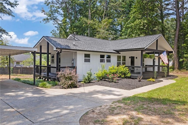 5601 Due W Rd, Powder Springs, GA 30127 - ranch-style house featuring a porch, roof with shingles, and a carport