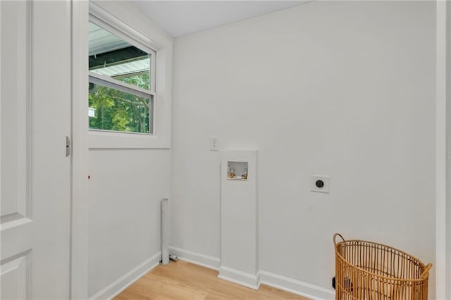 5601 Due W Rd, Powder Springs, GA 30127 - laundry room featuring hookup for an electric dryer, light wood finished floors, and washer hookup