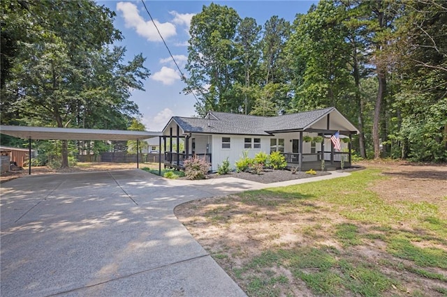 5601 Due W Rd, Powder Springs, GA 30127 - view of front of home featuring covered porch, driveway, and a carport