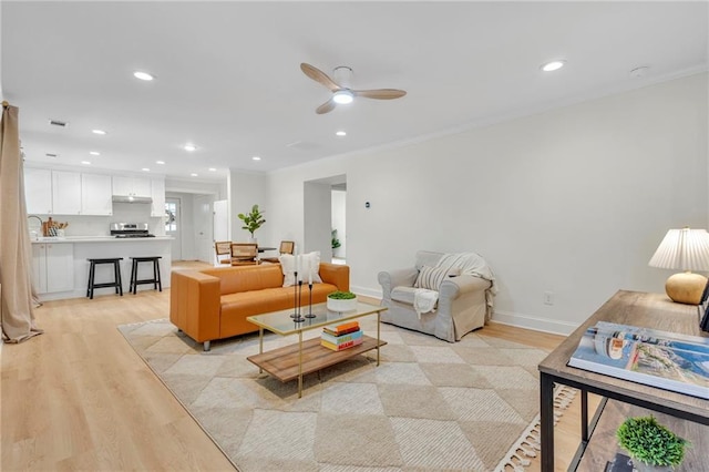 5601 Due W Rd, Powder Springs, GA 30127 - living area with light wood-style flooring, a ceiling fan, crown molding, and recessed lighting