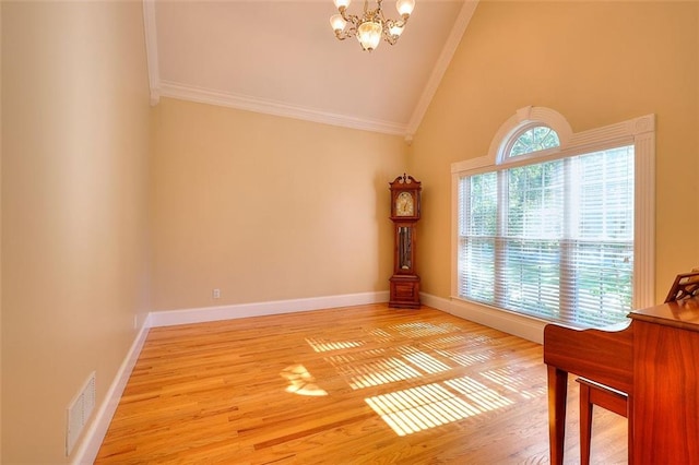 1595 Lake Lucerne Rd SW, Lilburn, GA 30047 - unfurnished room with crown molding, a chandelier, high vaulted ceiling, light wood-type flooring, and baseboards