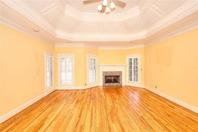 1595 Lake Lucerne Rd SW, Lilburn, GA 30047 - unfurnished living room with a ceiling fan, crown molding, light wood-style floors, a fireplace, and baseboards
