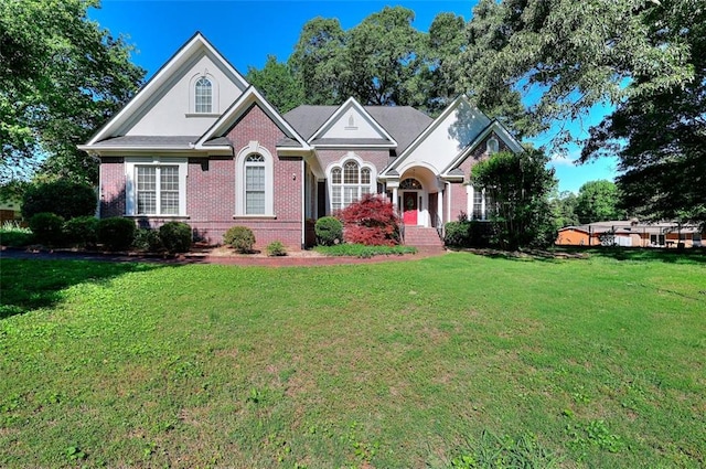 1595 Lake Lucerne Rd SW, Lilburn, GA 30047 - view of front of house with brick siding and a front lawn