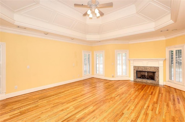 1595 Lake Lucerne Rd SW, Lilburn, GA 30047 - unfurnished living room with light wood-style flooring, crown molding, ceiling fan, coffered ceiling, and a fireplace