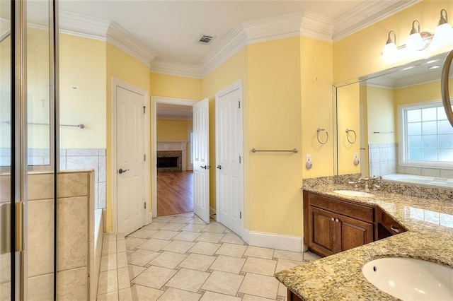1595 Lake Lucerne Rd SW, Lilburn, GA 30047 - bathroom with double vanity, a fireplace, a garden tub, ornamental molding, and tile patterned floors