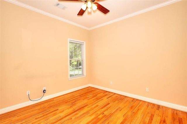 1595 Lake Lucerne Rd SW, Lilburn, GA 30047 - spare room with baseboards, light wood finished floors, ornamental molding, and ceiling fan