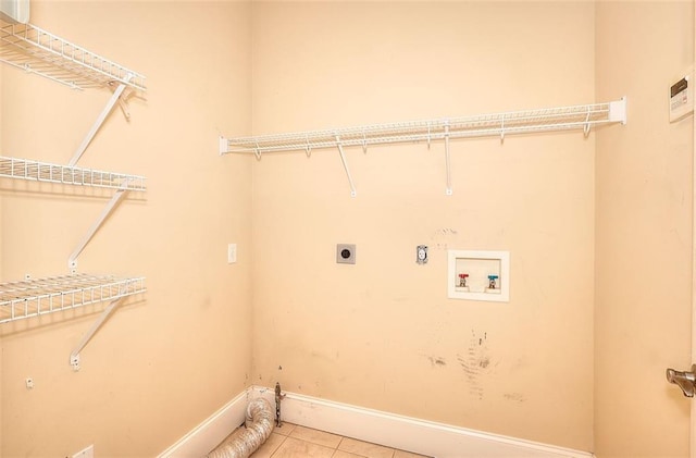 1595 Lake Lucerne Rd SW, Lilburn, GA 30047 - washroom featuring hookup for an electric dryer, baseboards, washer hookup, and tile patterned floors