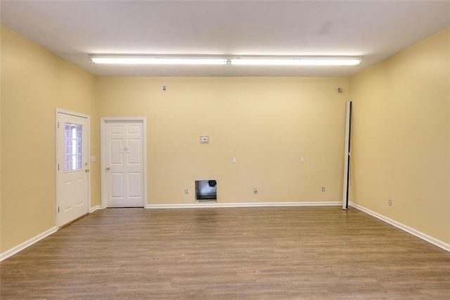 1595 Lake Lucerne Rd SW, Lilburn, GA 30047 - empty room with wood finished floors and baseboards