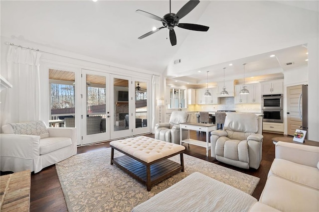 living room with french doors, ceiling fan, dark hardwood / wood-style flooring, and high vaulted ceiling