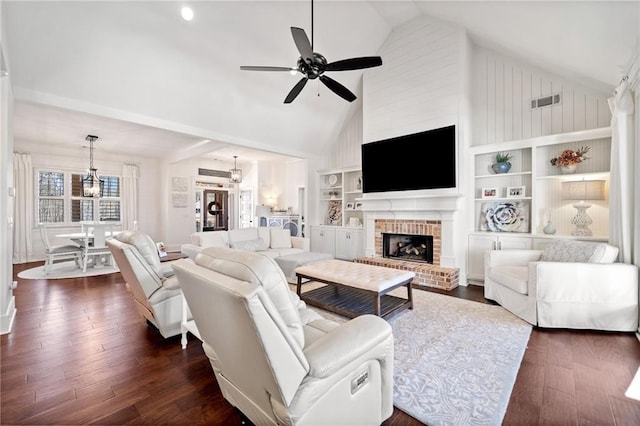 living room featuring dark wood-type flooring, built in features, ceiling fan, high vaulted ceiling, and a fireplace