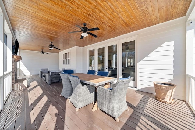 deck with an outdoor hangout area and ceiling fan