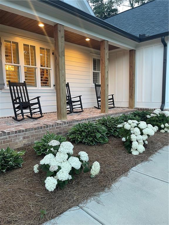 doorway to property featuring covered porch