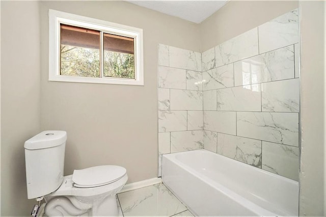 full bathroom featuring marble finish floor, toilet, and baseboards