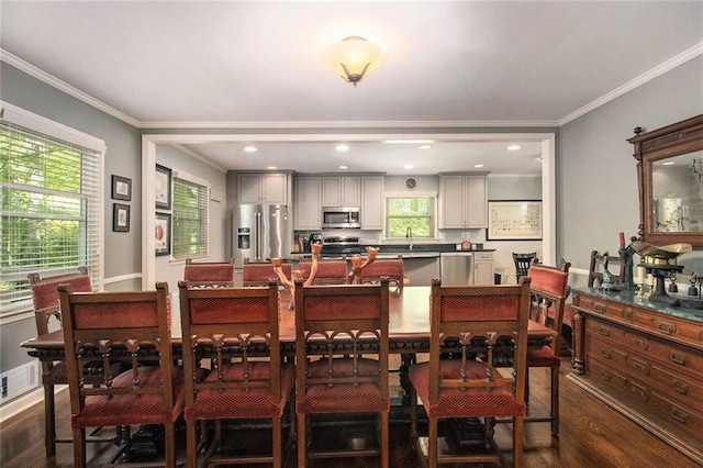 6590 Williamson Dr NE, Atlanta, GA 30328 - dining space featuring dark wood-style floors and crown molding