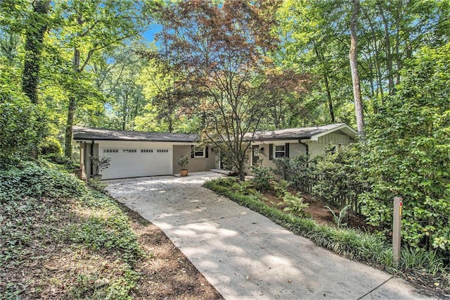 6590 Williamson Dr NE, Atlanta, GA 30328 - view of front facade featuring an attached garage and concrete driveway
