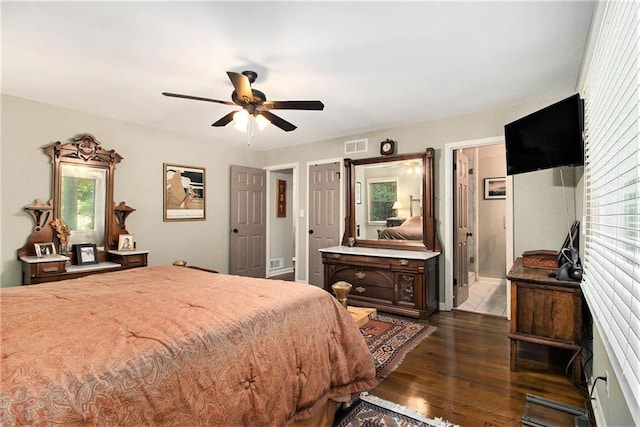 6590 Williamson Dr NE, Atlanta, GA 30328 - bedroom featuring multiple windows, dark wood-style floors, and a ceiling fan