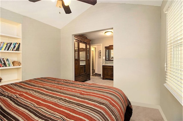 6590 Williamson Dr NE, Atlanta, GA 30328 - bedroom with light carpet, vaulted ceiling, baseboards, ceiling fan, and ensuite bathroom