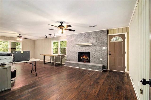 6590 Williamson Dr NE, Atlanta, GA 30328 - living area with a ceiling fan, hardwood / wood-style flooring, a fireplace, and crown molding