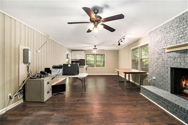 6590 Williamson Dr NE, Atlanta, GA 30328 - office area with a brick fireplace, ceiling fan, healthy amount of natural light, wood finished floors, and ornamental molding