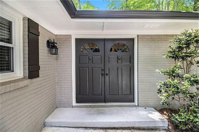 6590 Williamson Dr NE, Atlanta, GA 30328 - view of exterior entry featuring brick siding