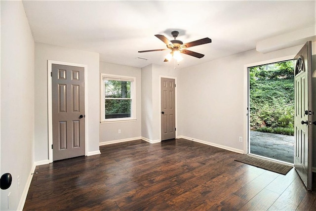 6590 Williamson Dr NE, Atlanta, GA 30328 - spare room featuring plenty of natural light, ceiling fan, dark wood-type flooring, and baseboards