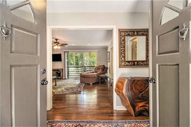 6590 Williamson Dr NE, Atlanta, GA 30328 - entrance foyer with wood finished floors, a ceiling fan, and a fireplace