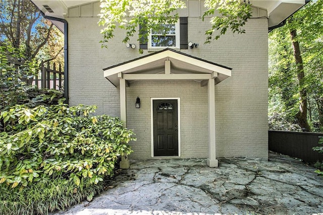 6590 Williamson Dr NE, Atlanta, GA 30328 - doorway to property featuring brick siding