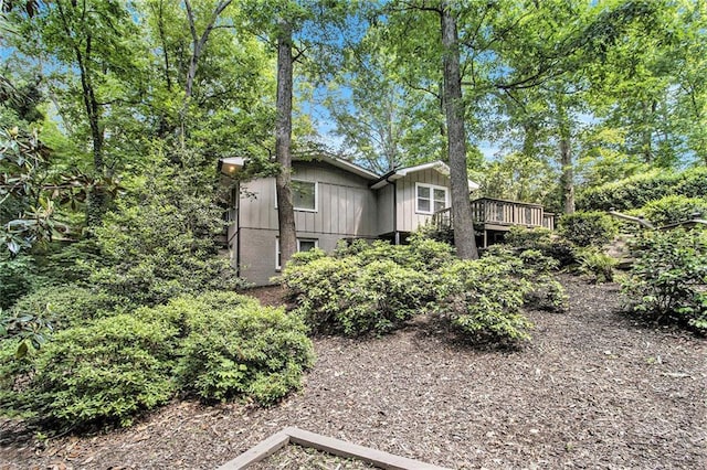6590 Williamson Dr NE, Atlanta, GA 30328 - back of house featuring board and batten siding and a wooden deck