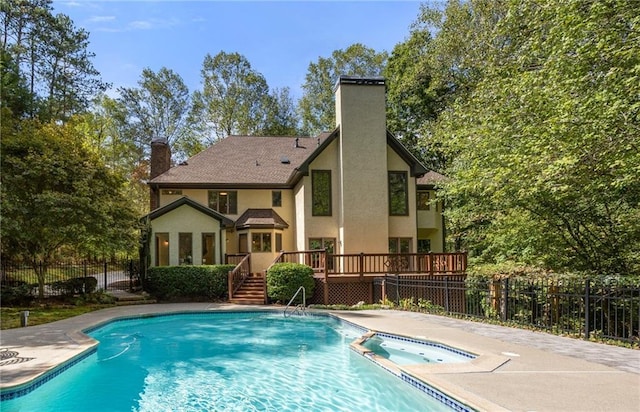 view of pool with a deck and a patio