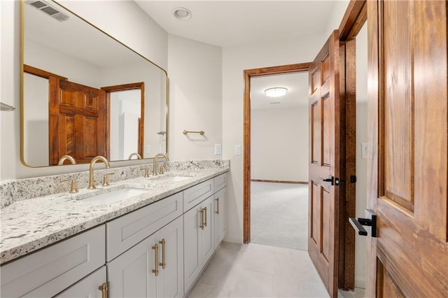 bathroom featuring tile patterned floors and vanity