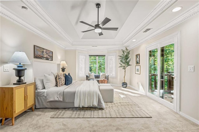 bedroom with access to exterior, a tray ceiling, ornamental molding, and light colored carpet