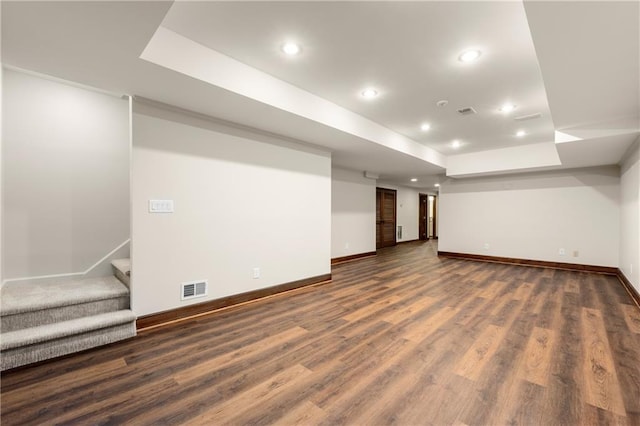 basement featuring dark hardwood / wood-style floors