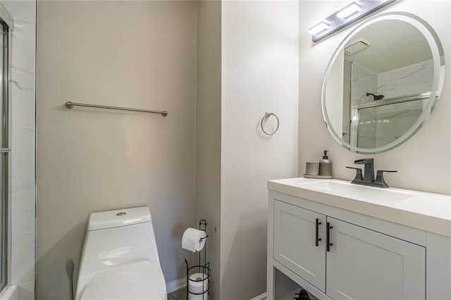 bathroom featuring toilet, an enclosed shower, and vanity