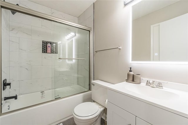 full bathroom with toilet, combined bath / shower with glass door, and vanity