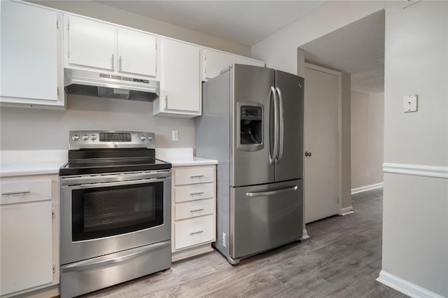 kitchen featuring white cabinetry, stainless steel appliances, and light hardwood / wood-style floors