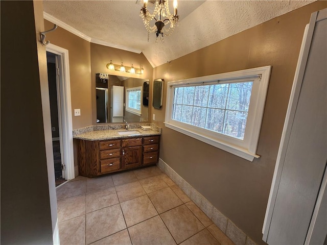 bathroom featuring lofted ceiling, tile patterned flooring, vanity, a textured ceiling, and an inviting chandelier